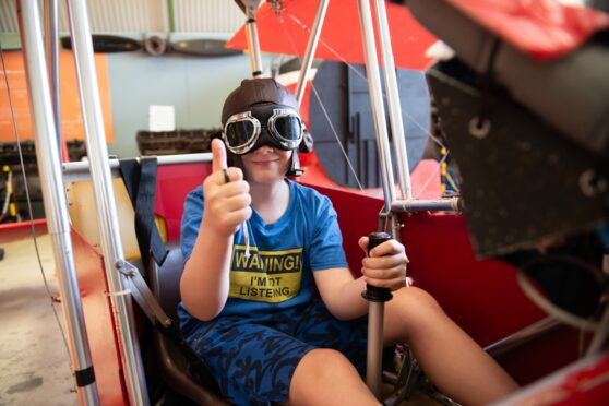 Lewis Gray tries his hand at flying the Red Baron's biplane.