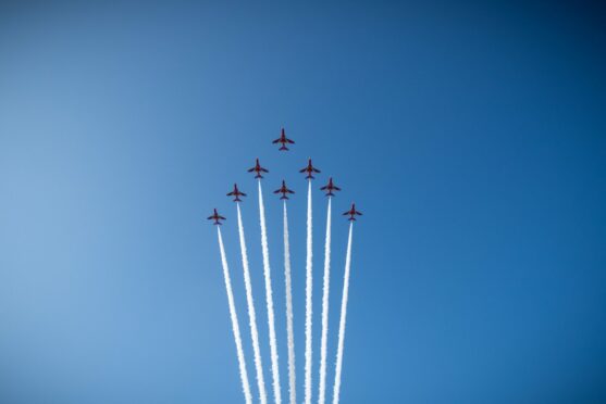 The Red Arrows fly past Montrose Air Station to mark the 110th anniversary.