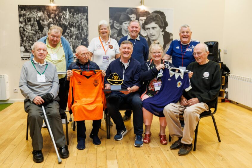 Former Scotland player Paul Hegarty with the members of the Dundee United Football Memories group. Image: Kenny Smith/DC Thomson.