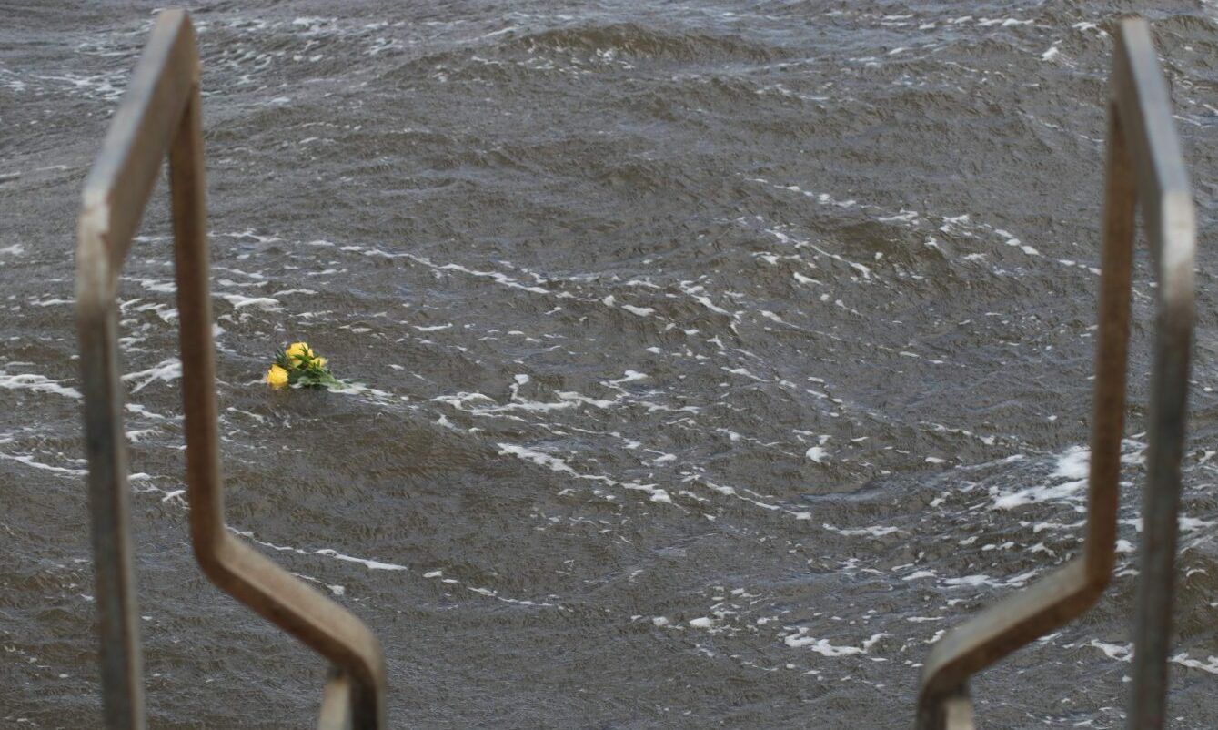 The photograph shows flowers were placed on the River Tay by Phibbies members in memory of Netta Spence.