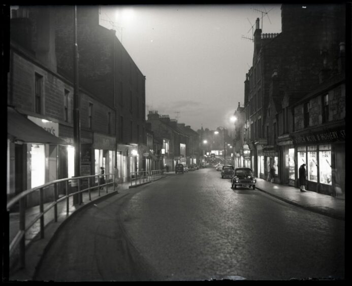 Lochee High Street at night in this image from 1960. Image: DC Thomson.