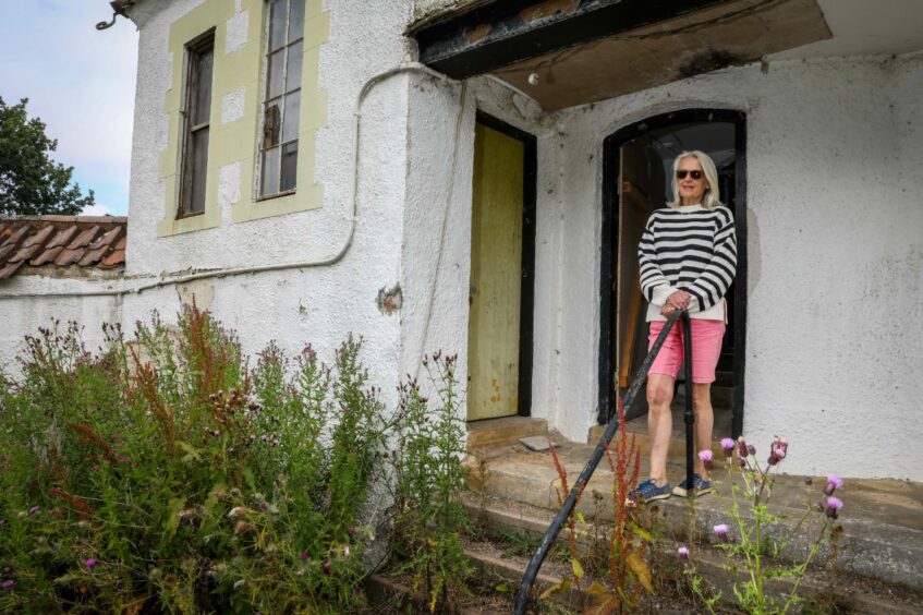 Margo Sproson rekindles memories inside the overgrown Dutch Village