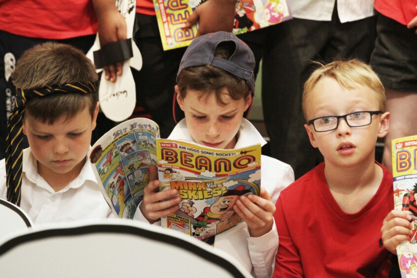 Dundee High School pupils reading Beano comics at The McManus in 2018. Image: DC Thomson/Mhairi Edwards.