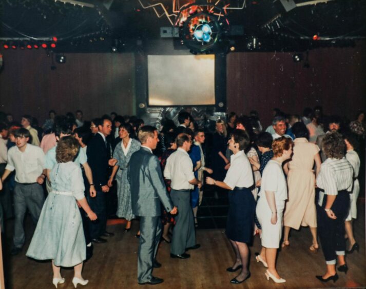People on the dance floor at Bally's Nightlife in Arbroath.