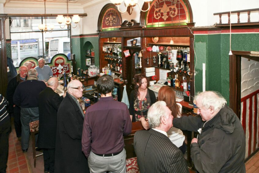 A busy scene in the Pillars Bar in 2012. Image: DC Thomson.