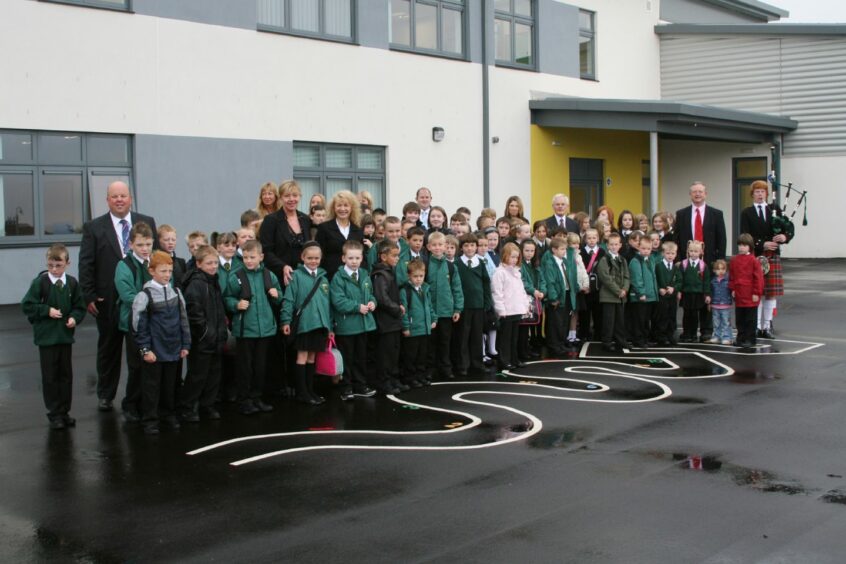 Piper Scott Findlay with pupils, teachers and elected representatives. Image: DC Thomson.