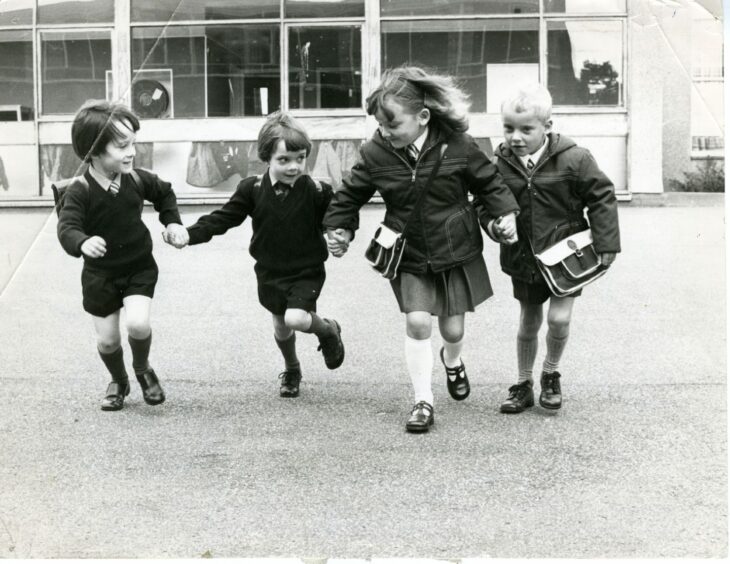 Steven and Gordon Farquharson and Tracy and Gary Henderson arriving at school. Image: DC Thomson.