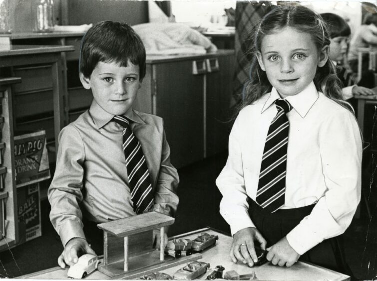 Twins Susan and Raymond Young playing on their first day at school. Image: DC Thomson.