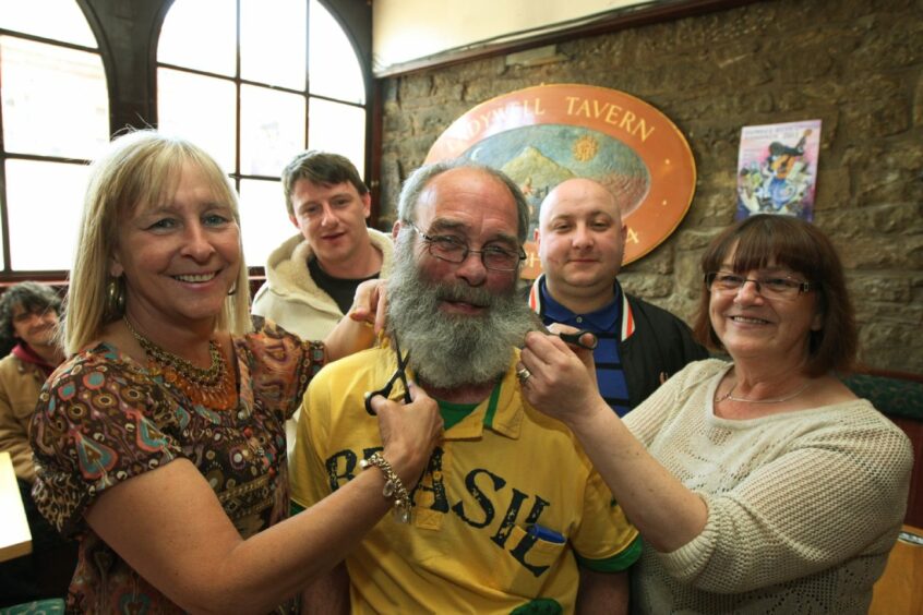 A charity beard shave takes place in the bar in 2011. Image: DC Thomson.