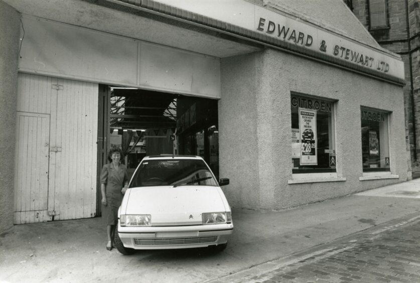 A staff member standing outside the Roseangle entrance. Image: DC Thomson.