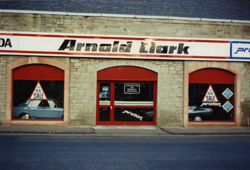 An exterior shot of the showroom, showing cars through the window. Image: DC Thomson.