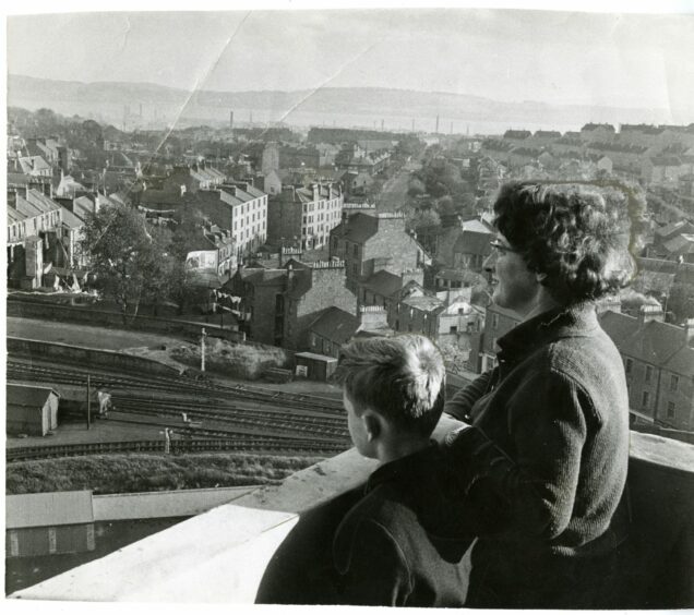 Kathleen Adams and her son Donald taking advantage of the 13th floor view in Burnside Court