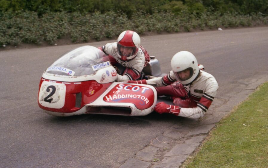 World Sidecar champion Jock Taylor with Lewis Ward keeping the third wheel down back in 1975