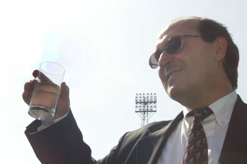 Giovanni di Stefano raises a glass following his appointment to the Dens Park board. Image: DC Thomson.