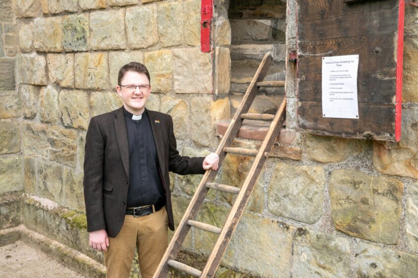 Minister Rev Dr Conor Fegan at the door entrance. Image: Steve Brown/DC Thomson.