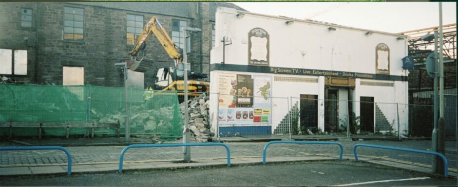 The demolition crew get to work and the Westport Bar came tumbling down. Image: DC Thomson.