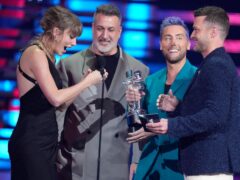 (from centre) Joey Fatone, Lance Bass and Justin Timberlake of NSYNC present the award for best pop to Taylor Swift (far left) (Charles Sykes/AP/PA)