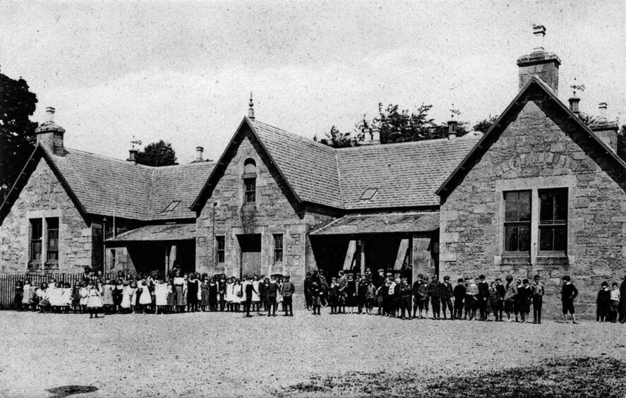 A busy shot of the school, with pupils lined up outside the building, is included in the book. Image: Stenlake Publishing Ltd.