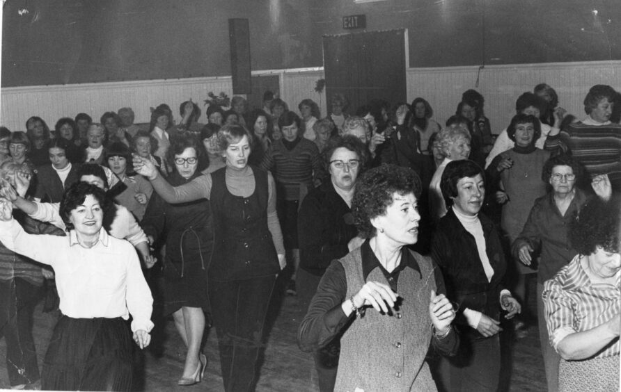 These housewives were throwing out some John Travolta moves on the dance floor in 1979. Image: DC Thomson.