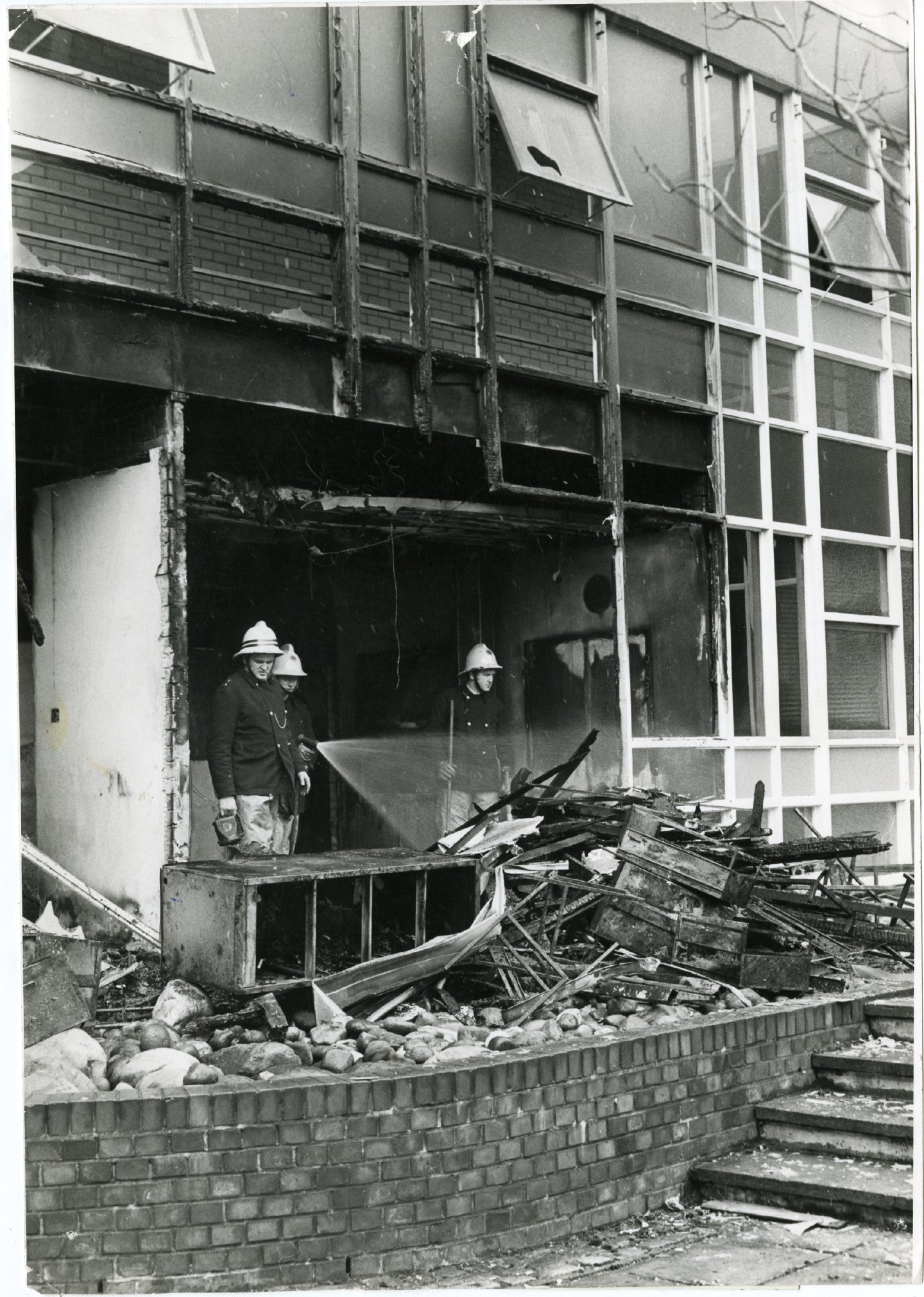 Firefighters beside a burned out building after the St Saviour's fire. Image: DC Thomson.