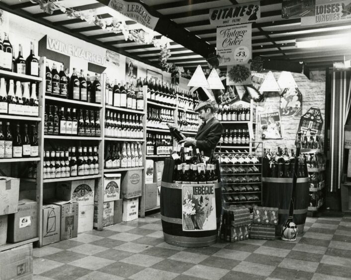 A man looks at wine inside Trademarket Store. Image: DC Thomson.