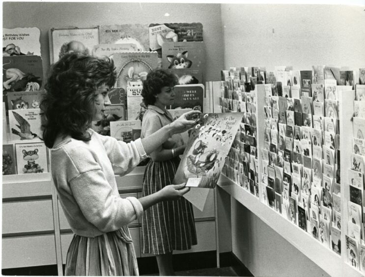 Two staff members checking cards for quality in 1984. Image: DC Thomson.