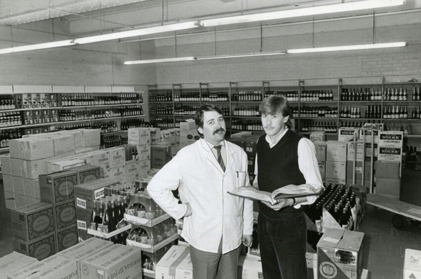 Two staff members in Watson &amp; Philip cash and carry in Larch Street in 1984. Image: DC Thomson.