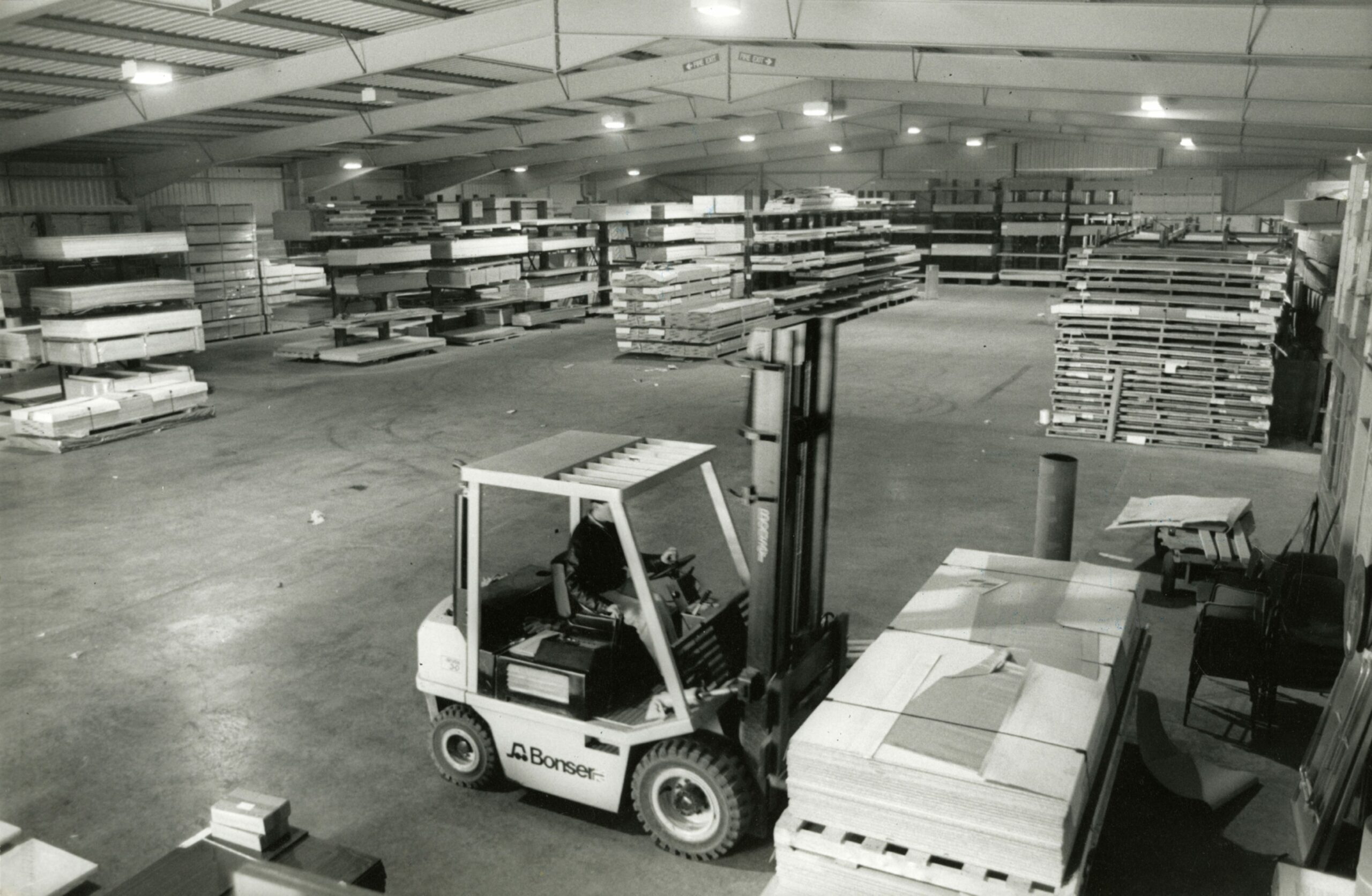A staff member moving materials in the warehouse. Image: DC Thomson.
