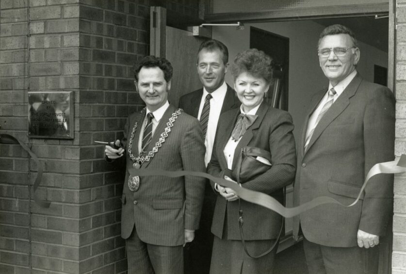 Dundee Lord Provost Tom Mitchell cutting the ribbon in April 1989 to officially open the new premises of E.F.K. (Aluminium) at West Pitkerro Industrial Estate.