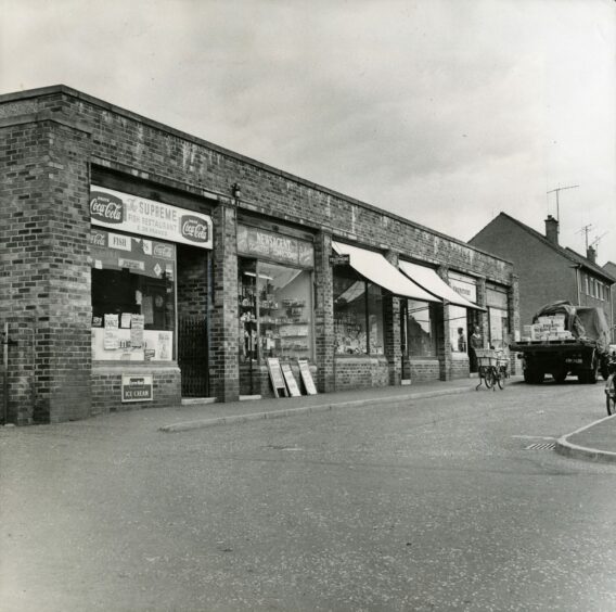 The row of shops including a newsagent and fish and chip shop. Image: DC Thomson.