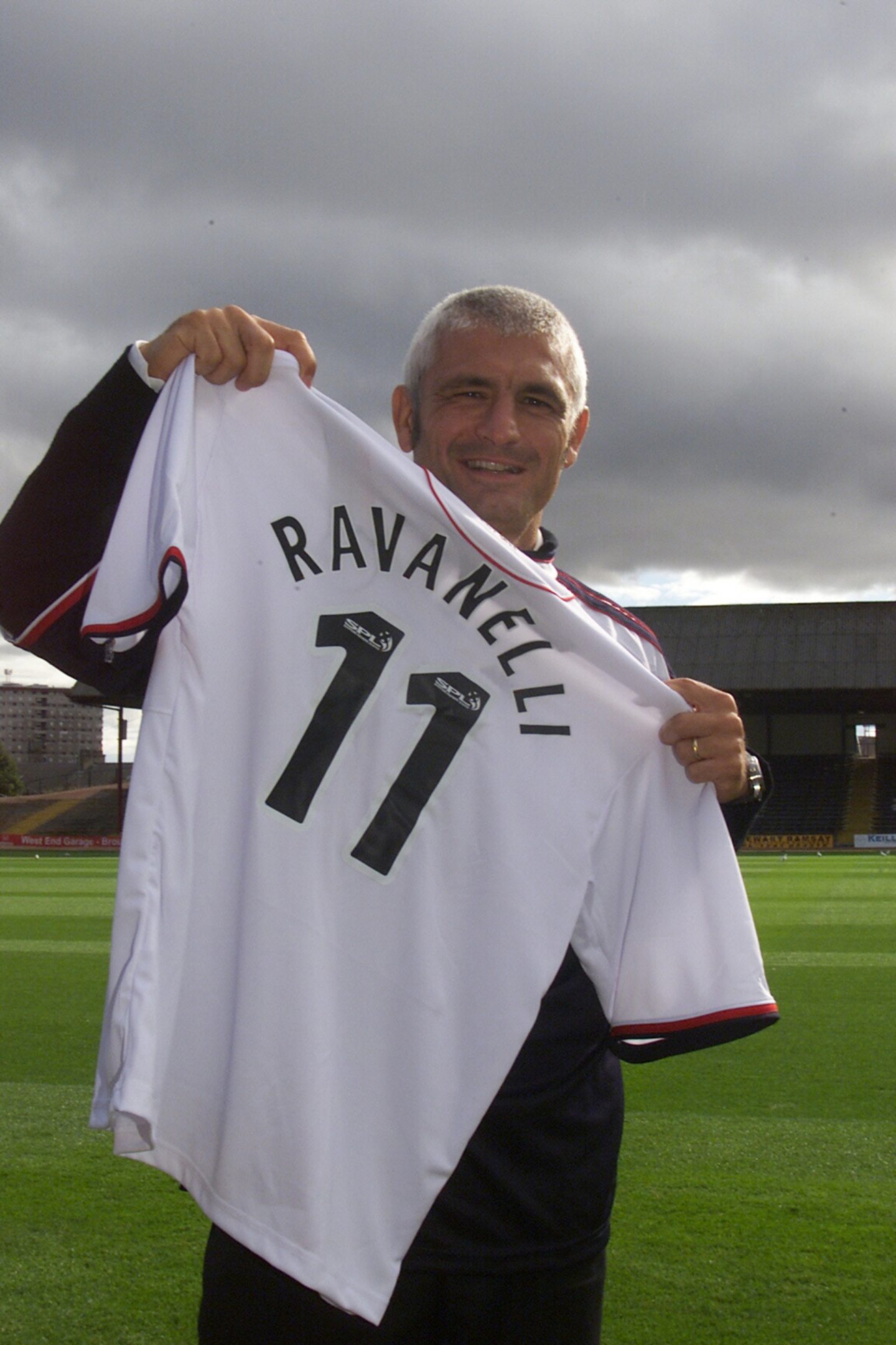 Ravanelli, smiling and holding a Dundee shirt, was the English Premier League top scorer seven years before joining Dundee. Image: DC Thomson.