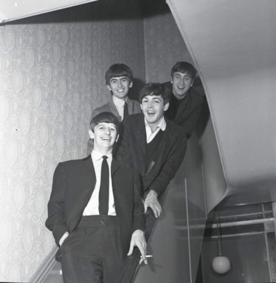 The Beatles were having a great time when they arrived at the Caird Hall. Image: DC Thomson.