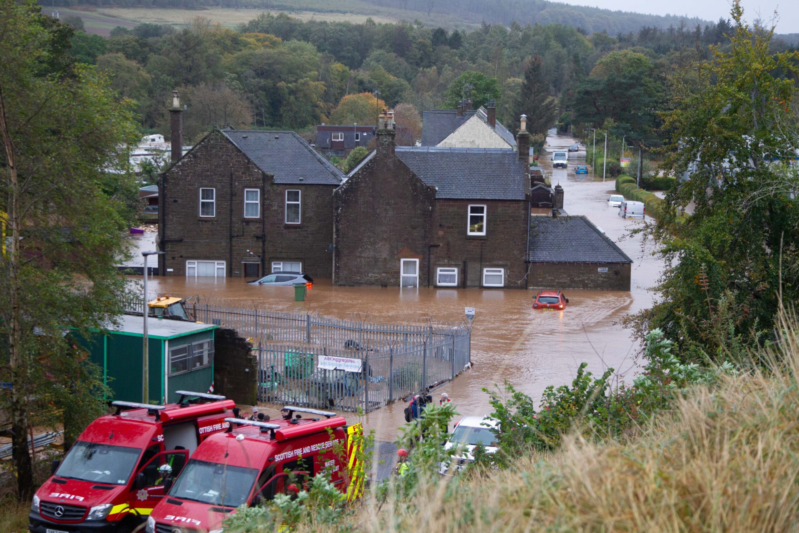 Drone shot shows homes and cars in Brechin underwater following Storm Babet.
