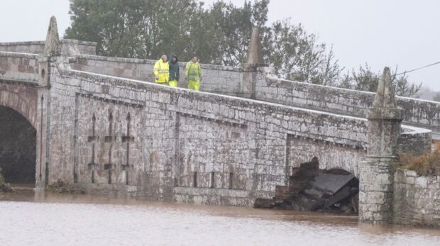 A view from the side of the river shows the damage to the bridge. Image: Paul Reid.