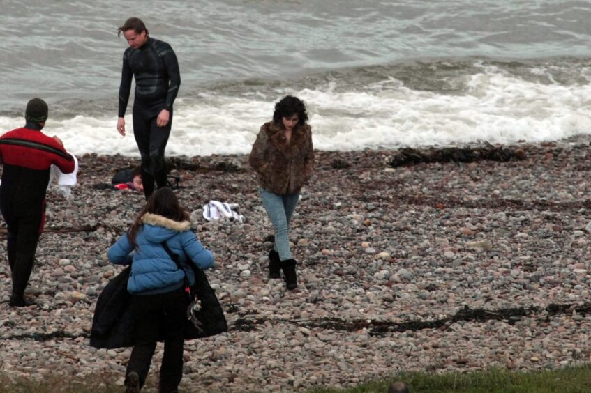 Scarlett Johansson and the film crew on the Angus beach.