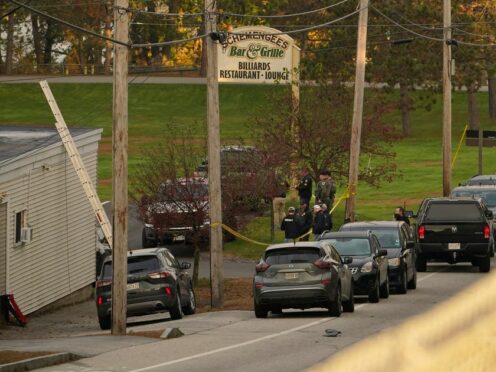 Law enforcement outside Schemengee’s Bar and Grille in Lewiston, Maine, after a mass shooting (Robert F Bukaty/AP)