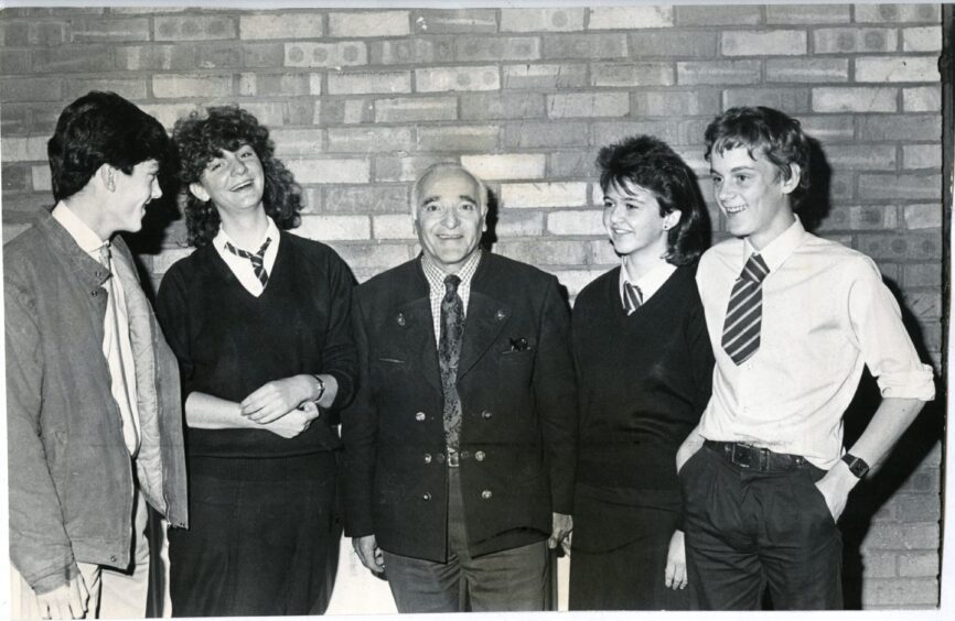 Pastor Tony Pokorny with pupils in October 1985. Image: DC Thomson.