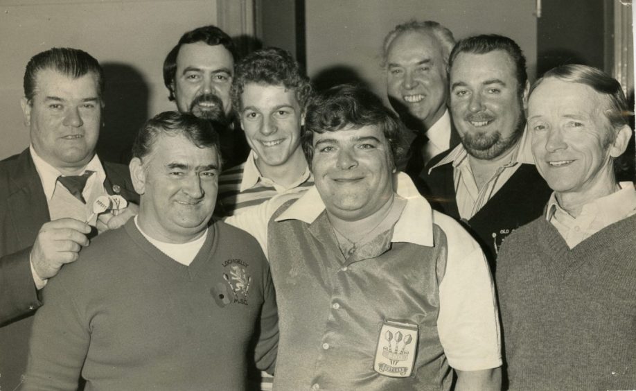 Jocky Wilson with a group of fans at the home international tournament in 1982. Image: DC Thomson.