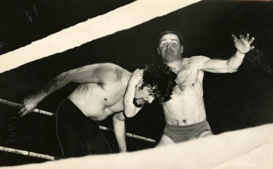 George Kidd wrestles Ivor Penzekoff at the Caird Hall in 1965. Image: DC Thomson.