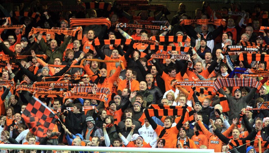 The United fans, holding up scarves and singing, were in great voice throughout the match. Image: DC Thomson.