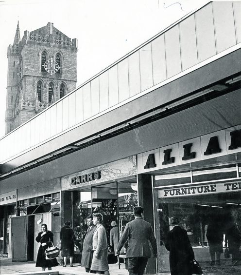 The Old Steeple, Dundee's showpiece of history, towers over the new Overgate shops. 