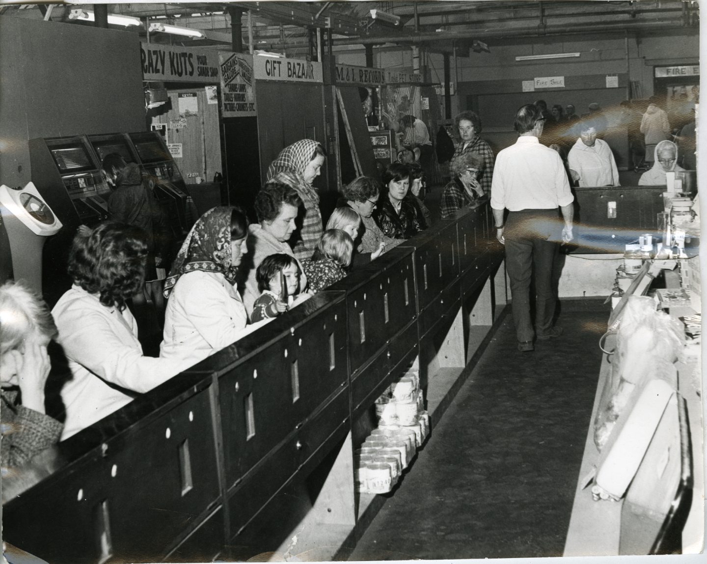 A busy scene at the bingo stand in Dens Road Market in 1972.