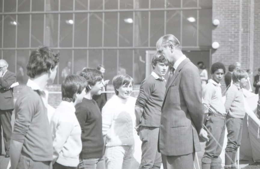 Prince Philip talks to pupils at Whitfield High School, Dundee, in 1982. Image: DC Thomson.