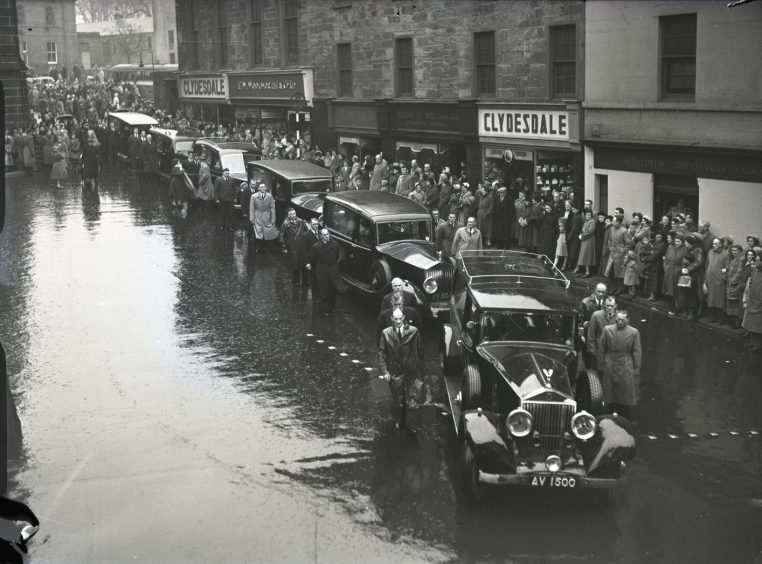 Hearses pass through the streets of Arbroath as the town stands still during the funeral procession. Image: DC Thomson.