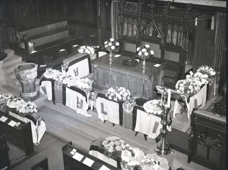 The sombre scene inside the church during the service. Image: DC Thomson.