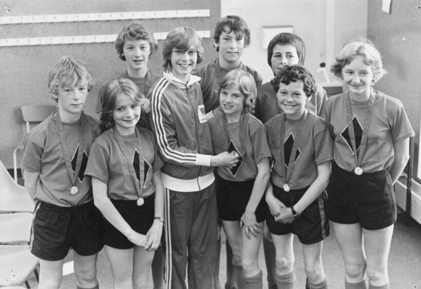 The We Are The Champions team with 1980 Olympics star Linsey MacDonald. Image: DC Thomson.