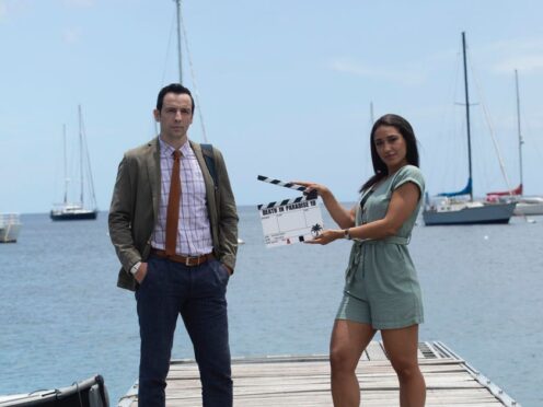 DI Neville Parker, played by Ralf Little and DS Florence Cassell, played by Josephine Jobert in Death In Paradise (BBC/Denis Guyenon/PA)