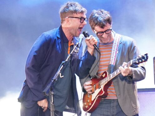 Damon Albarn and Graham Coxon of Blur performing on stage at Wembley Stadium in London (Ian West/PA)