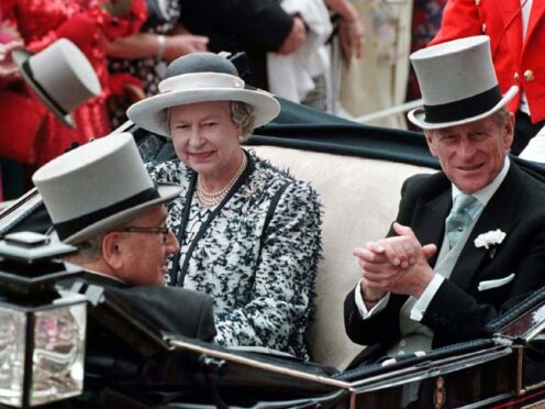 Henry Kissinger in 1995 with the late Queen Elizabeth II and the late Duke of Edinburgh (PA)