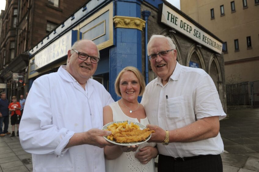 Lawrence, Dot and Raymond Sterpaio with the last fish supper in 2014. Image: DC Thomson.